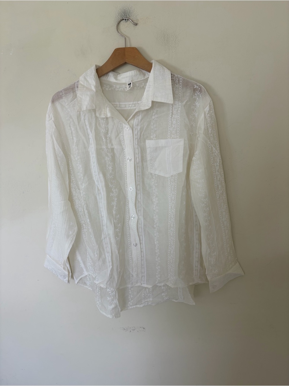 white sheer cotton shirt features intricate lace vertical panels embroidered boh